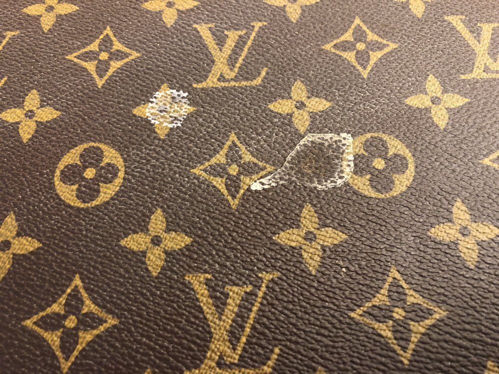 Louis Vuitton, a large monogrammed canvas and leather suitcase, late 20th century, opening to reveal - Image 5 of 11