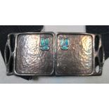 An Arts & Crafts silver & enamel buckle by Levi & Sampson, Birmingham, 1908, the repoussé square