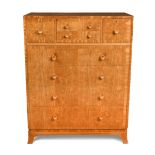 A good quality Art Deco walnut chest of drawers, with an arrangement of four drawers over four