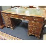 A reproduction mahogany pedestal desk on bracket feet, 79 x 151 x 90cm