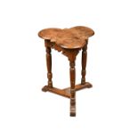 An Arts & Crafts oak occasional table by Wiliam G. Cooper of Tradeshill, Frome, the moulded