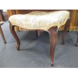 A Victorian upholstered stool on swept legs