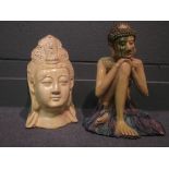 A pottery figure of Buddha and a ceramic head of Buddha