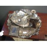 Three silver photograph frames, together with a loaded silver candlestick, an unmarked toddy