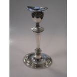 A George III style silver candlestick, 30cm high