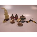 Three resin netsuke, an onyx ornament of birds and three hardstone ornaments with white metal