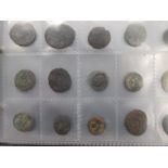 A folder of approximately 140 Roman and other coins including milled some silver, mostly metal