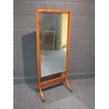 A 20th century cheval mirror with brass inlays, 147 x 59cm