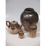An 18th century stoneware bellarmine jug (A/F), saltglazed pottery to include a jug, large jar and