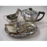 A silver three piece tea set and a small quantity of silver flatware, 29.2ozt gross, together with a