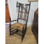 A bobbin framed rocking armchair