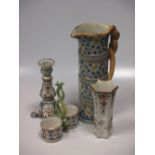 Items of Continental pottery and porcelain to include candlesticks, an Italian two bottle holder