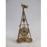 A late 19th century French gilt metal timepiece, on a tripod stand, 34cm high