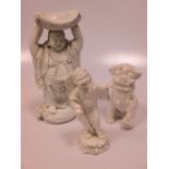 A pair of Blanc de Chine, dog of fo and six other figures (8)