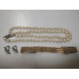 A five bar gate bracelet stamped '9' , 23.5g together with a single row of cultured pearls and a