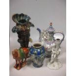A Persian vase, a Portuguese Persian style ewer, a Sitzendorf white glazed figural candlesticks,