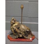 Bronze figural lampbase of a reclining lady