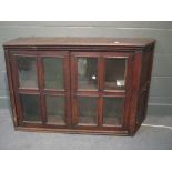 An 18th century oak two door glazed hanging cabinet, approximately 82 x 125 x 30cm