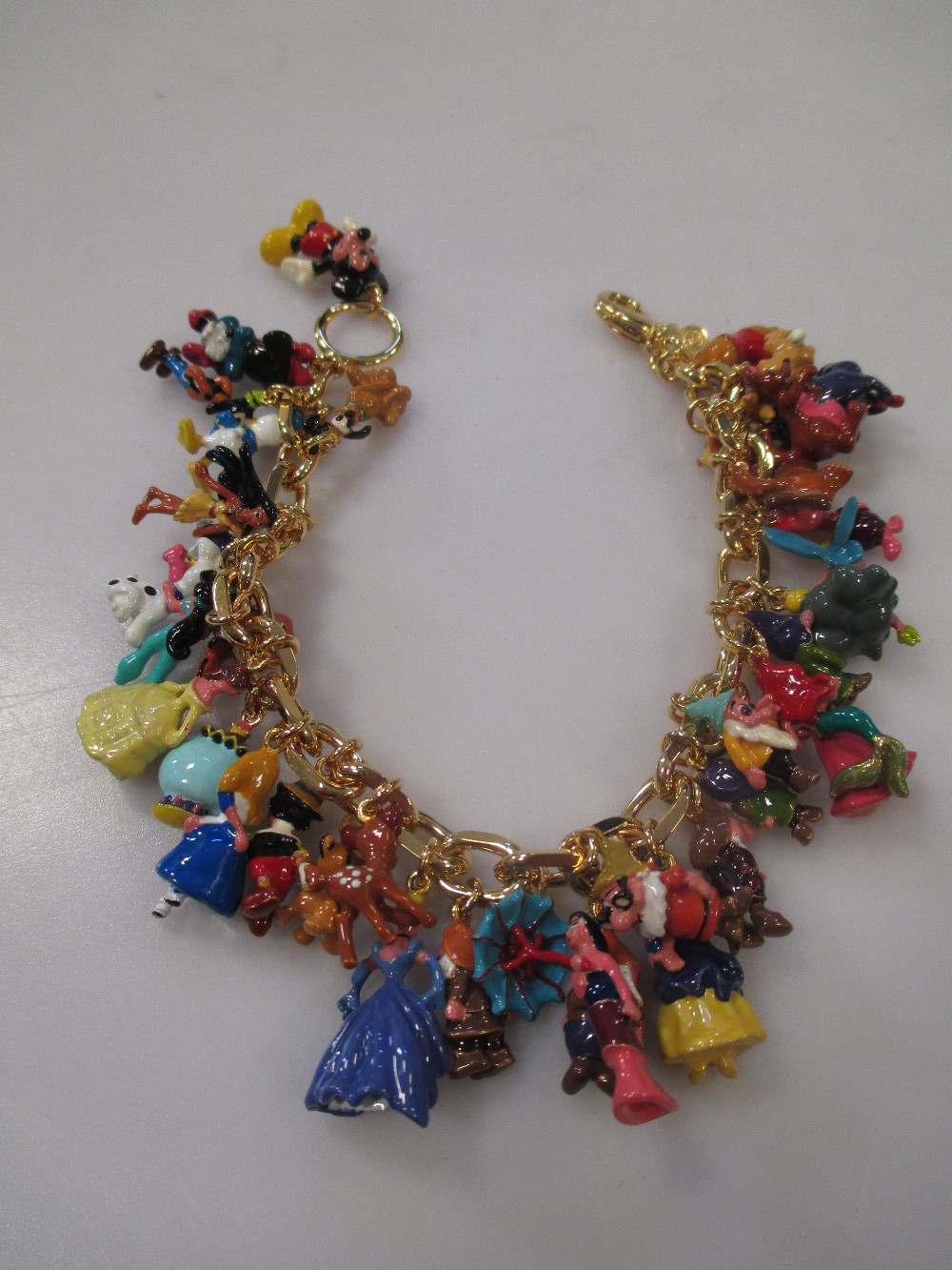 A 24ct Gold Plated Ultimate Disney Classic Charm Bracelet Featuring 37 Disney Characters