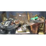 An Arts & Crafts copper pipe holder, various items of brassware to include candlesticks and