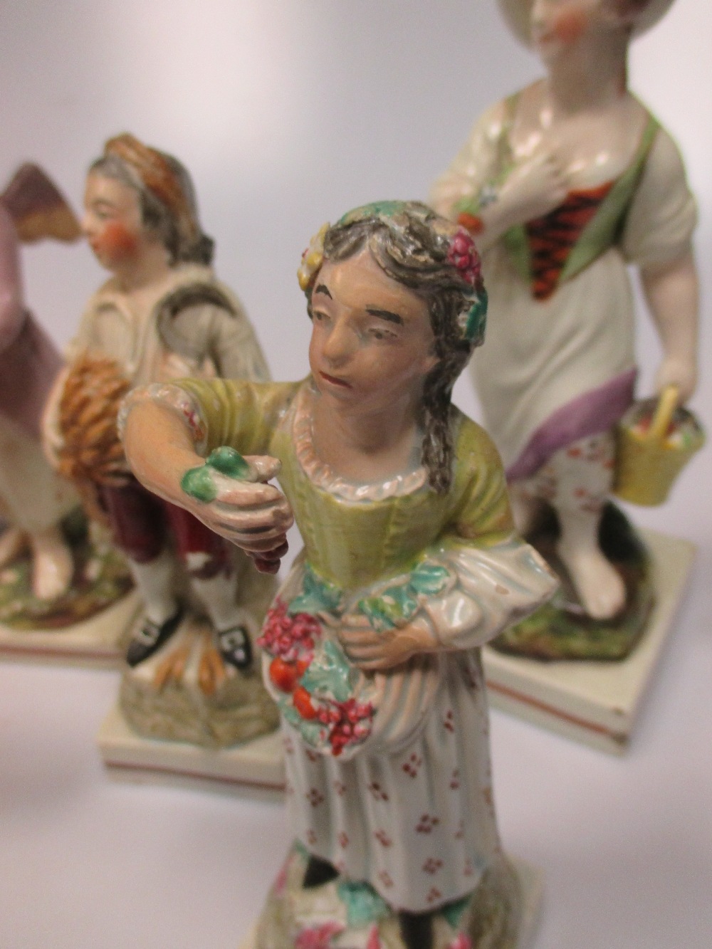 A Staffordshire figure group of Elijah, a pearlware figure emblematic of 'Winter', seven other - Image 4 of 5