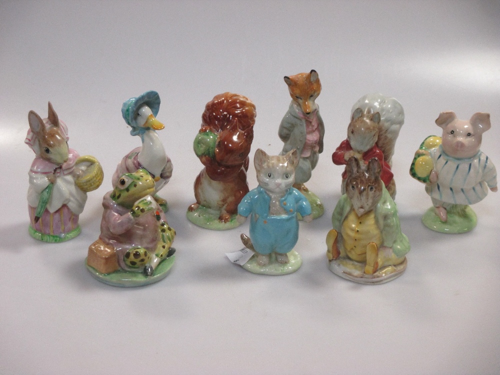 A collection of Beswick Beatrix potter figures, 9 figures with gold oval backstamp c1955-72 to