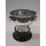 A collection of silver items including a rose bowl, salver, cased sets of teaspoons, ashtray,