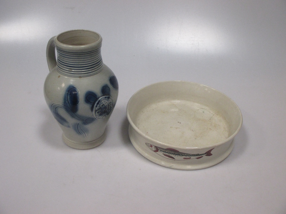 An 18th century Staffordshire commemorative jug, the ovoid scratch blue decorated body moudled in