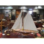 A wooden model yacht on stand, and cross section of a Georgian warship (2)