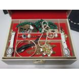 A jewellery box containing a large quantity of costume jewellery, together with two gold crosses