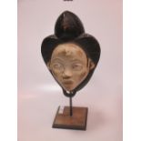 A Gabon tribal carved head on stand