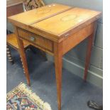 An Edwardian satinwood card table with paterae and outfolding top leaves