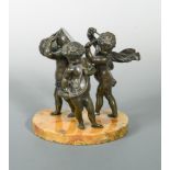 A 19th century bronze group of musical putti, one holds a kettle drum on his back for another to