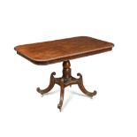 A Regency mahogany rectangular breakfast table, with beaded edge and rounded corners, on baluster