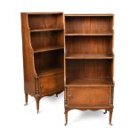 A pair of Regency style mahogany waterfall bookcases, 20th century, with crossbanded decoration,
