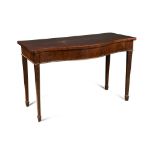 A George III mahogany serpentine serving table, with a blind frieze drawer, on leaf carved