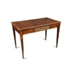 A Louis XVI style parquetry inlaid bureau plat, and with gilt brass mounted border and applied