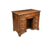 A George III mahogany kneehole desk, with moulded border, one long drawer, kneehole drawer, cupboard