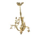 An ormolu three branch hanging lamp, the three branches with mistletoe sprigs supported on ribbon