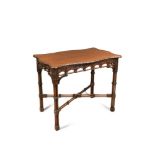 An Edwardian 'Chippendale' style mahogany centre table, of serpentine outline, blind fret and