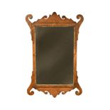 A large 18th century walnut fret framed mirror, with gilt bezel 108 x 71cm (42 x 28in)