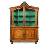 An early 19th century Dutch floral marquetry vitrine, with arched back and carved urn central boss