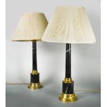 A pair of black marble and brass mounted columnar table Lamps, mounted to a spreading circular foot,