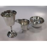 An silver cream jug, a silver goblet and a silver sugar bowl 7.3ozt gross (3)