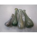 Four Roman opalescent glass phials, c.10cm (4)