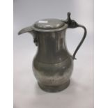 An 18th century pewter tappit hen lidded jug, touch marks to base ‘L.V.W.' in shield, 22.5cm high