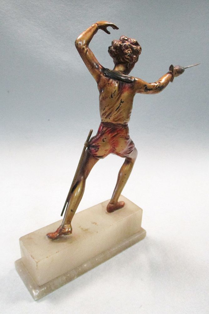 An Art Deco cold painted figure of a female fencer, standing en garde, mounted to an onyx plinth - Image 4 of 9