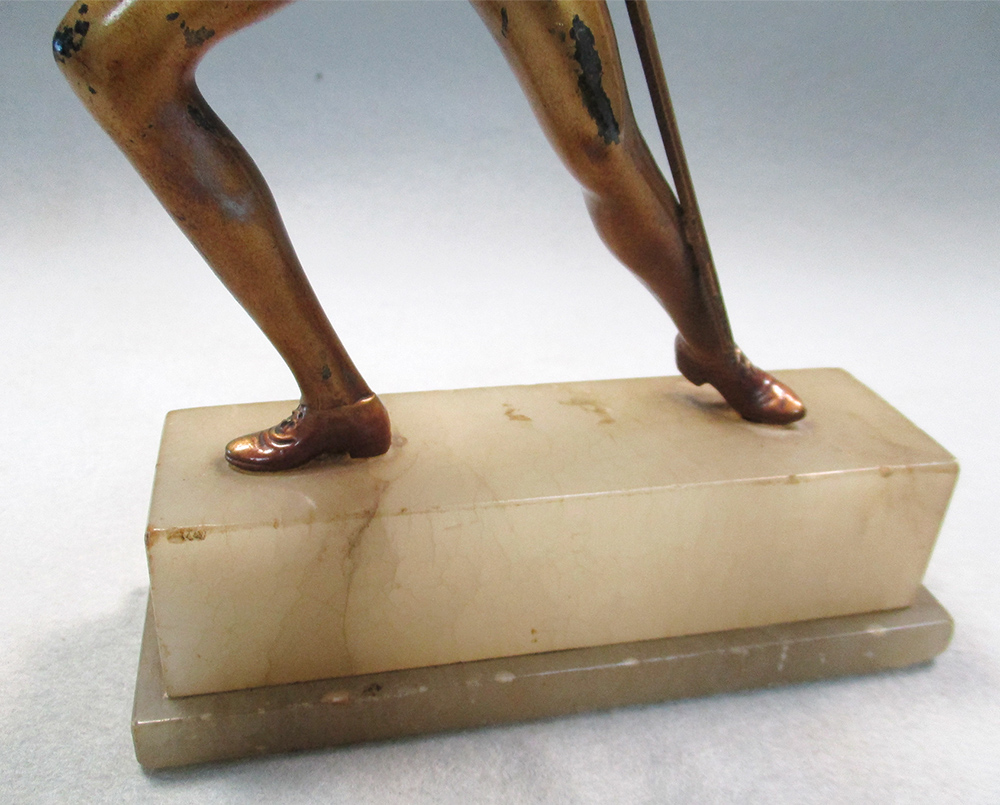 An Art Deco cold painted figure of a female fencer, standing en garde, mounted to an onyx plinth - Image 3 of 9