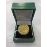 A 9ct gold ring containing a 1914 full sovereign, 15.5g