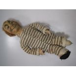 A George Robey fabric doll, probably by Dean's Rag Book Co., with pronounced features, striped